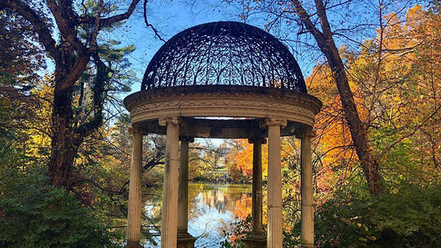 The Temple of Love stands at the edge of the East Lake at Old Westbury Gardens in the fall season