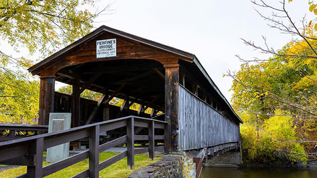 Perrine’s Covered Bridge spans the Wallkill River and stands as a manmade landmark amid the natural surrounding forest