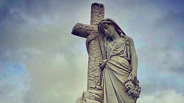 A statue set against a gray sky at Pinelawn Memorial Park and Arboretum in Farmingdale