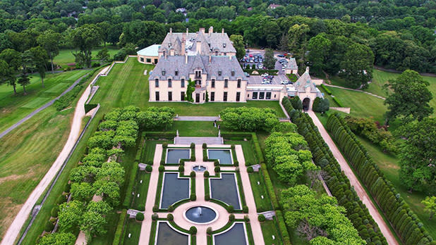 Aerial view of Oheka Castle with fountains and gardens leading up the entryway