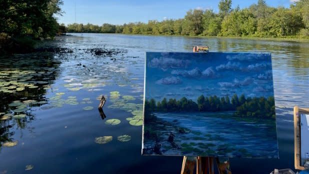 A painting of a lake in front of a lake