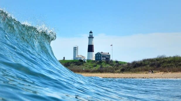 Waves crest in front of the beaches of the Montauk Lighthosue