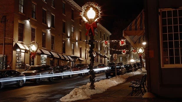 Wreaths hang along a street in downtown Saratoga Springs