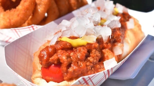 A Michigan "Red Hot" (a hot dog topped with meat sauce) on a paper plate