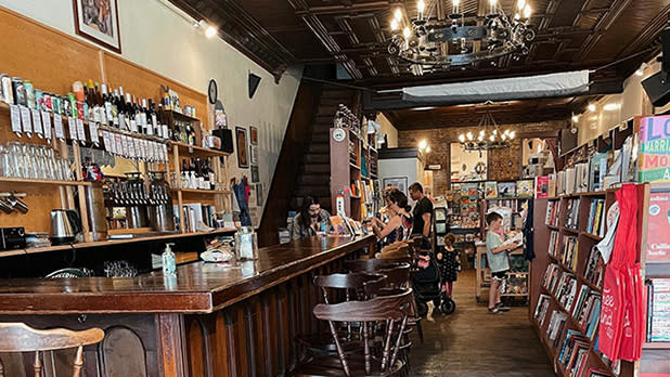 Customers sit at the bar of The Spotty Dog Books & Ale in the Hudson Valley