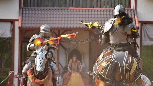 Knights on horses face each other as they prepare to showdown