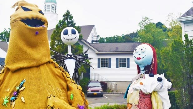 Scarecrows line the walkway at Stony Brook Village