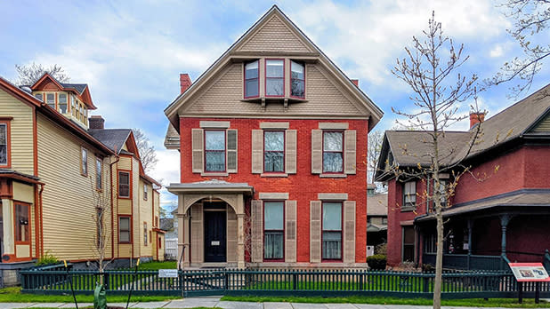 The cream and orange facade of Susan B. Anthony's house in Rochester