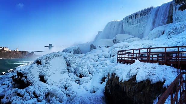 Snow blankets the rocks surrounding the Cave of the Winds at Niagara Falls