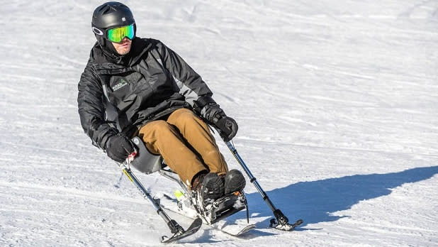 An adaptive skier in action on a snow-covered slope on Windham Mountain
