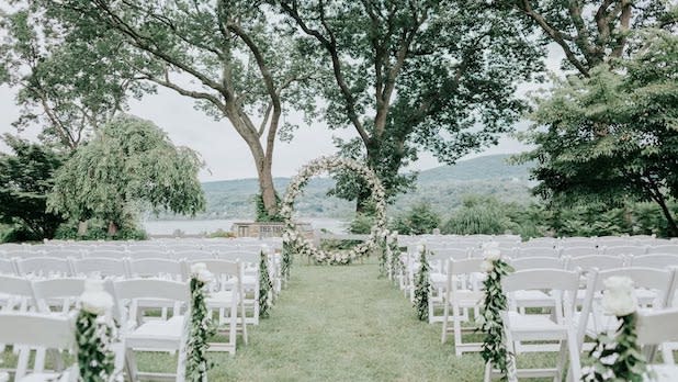 View from the aisle of a wedding ceremony on the lawn of the Thayer Hotel at West Point overlooking the Hudson River