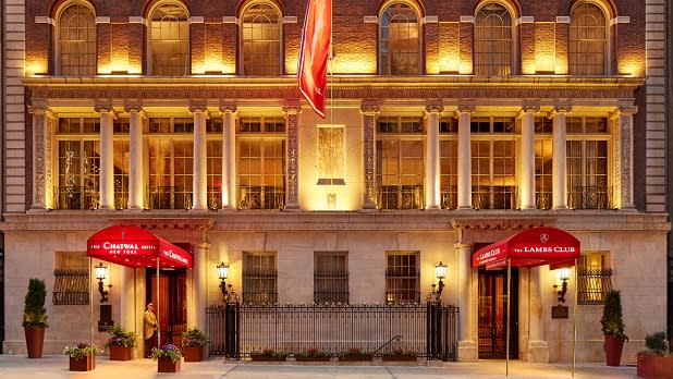 Red awnings over the entrances outside The Chatwal in New York City