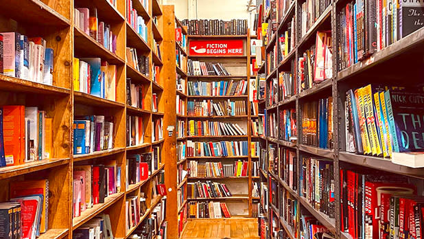 Bookshelves stacked with books within The Strand Bookstore