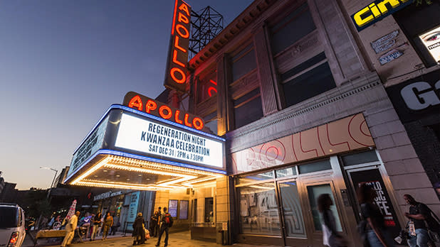 The illuminated entrance to Apollo Theatre at dusk