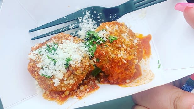 Meatballs in tomato sauce and topped with fresh parmesan cheese and herbs at the Taste of Ellicottville festival