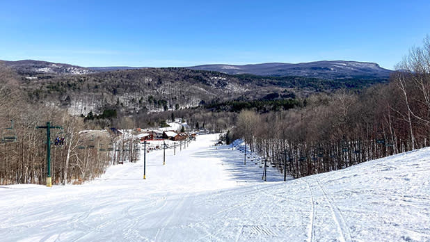 View from the top of a snowy hill at Titus Mountain