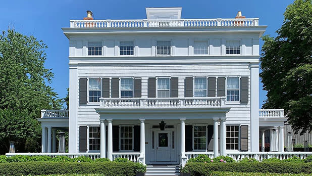 White exterior of Topping Rose House in summer