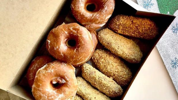 A box of glazed and peanut stick donuts from DiCamillo Bakery
