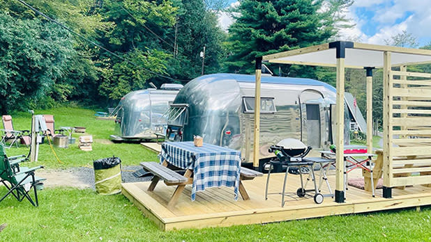 A shiny silver Airstream camper is seen at Treetopia Campground in the Catskills