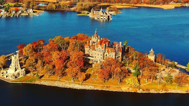 Trees resplendent in fall foliage surround Boldt Castle