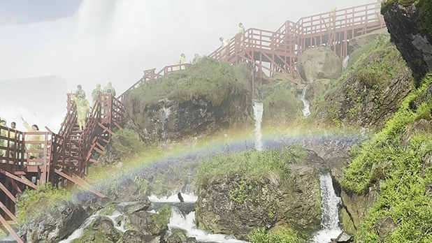 View of a rainbow over the stairs at Cave of the Winds Niagara Falls