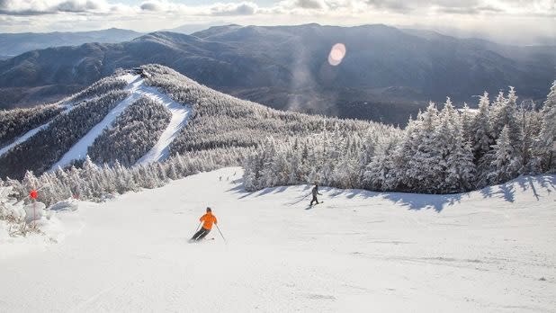 Skiers skiing down Whiteface Mountain
