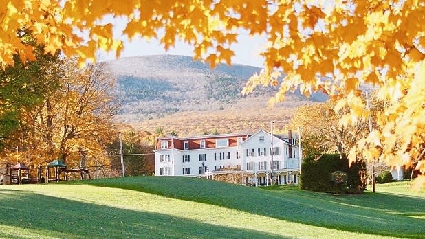 Golden fall foliage surrounds the White Clove Inn family resort in the Catskills
