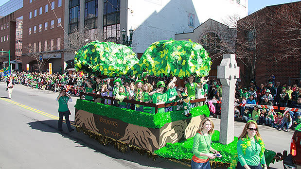 A bright green float makes it way through the Syracuse St. Patrick's Day Parade
