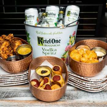 Bucket of Ketel One Vodka Spritz and appetizers from Parlay Sporting Club + Kitchen