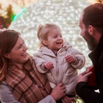 Family laughing during Wildlights at the Columbus Zoo and Aquarium