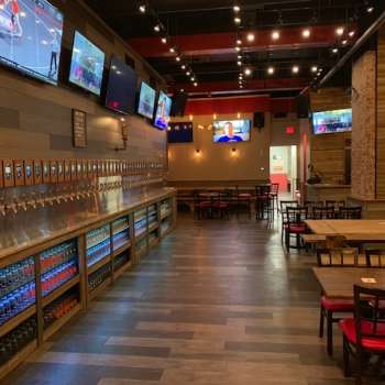 Interior of Whistle & Keg. Wall is lined with beer taps