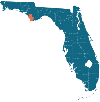 Blue state of Florida Map that has dotted lines for each county. Gulf County is located in the the middle of the panhandle with an orange color.