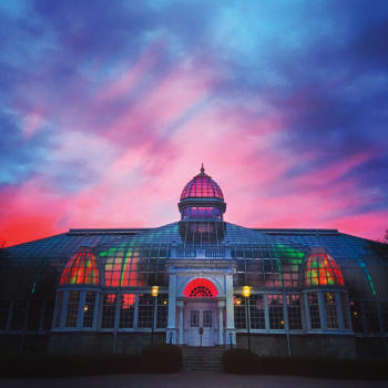 A sunset photo of the John Wolfe Palm house at the Franklin Park Conservatory and Botanical Gardens.