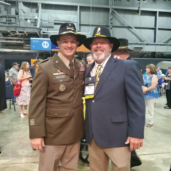 two men in military uniforms at a military reunion event