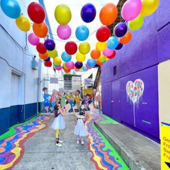 2 kids at Umbrella Alley - murals and art in Fisherman's Wharf San Francisco