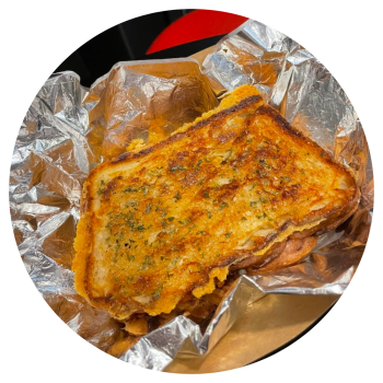 A perfectly crispy grilled cheese with oozing cheese