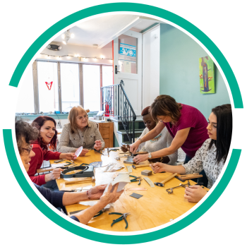 people putting jewelry together at watchmakers daughter