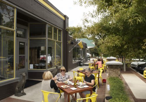 people sitting at table outside