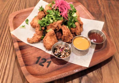 fried dish with colorful greens