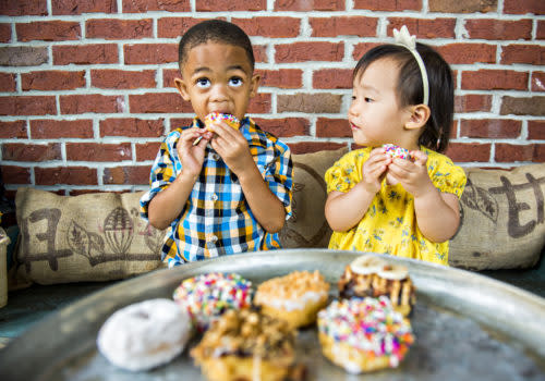 kids eating doughnuts