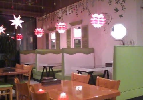 pink lights over restaurant booths