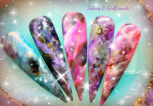 Festive galaxy themed nails are now available at Sidney & Girlfriends Nails & Day Spa in Martinsville and Nails by Sidney in Mooresville!