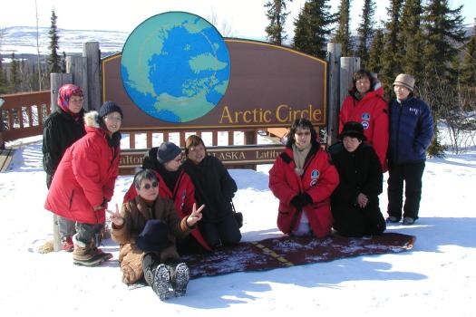 Winter Group at Arctic Circle Sign