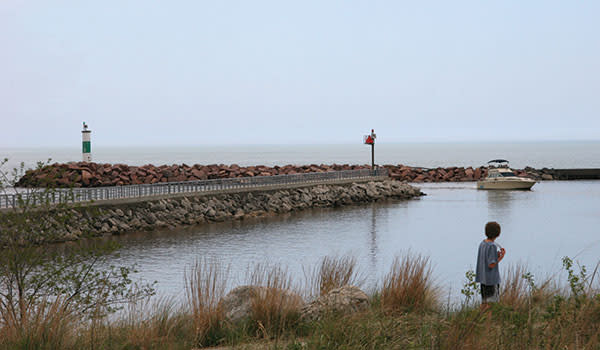 Boy looking at the Portage Lakefront and Riverwalk