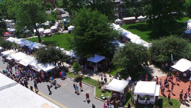 White tents line the street as crowds gather at the LARAC June Arts Festival