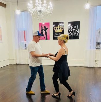 Couple learning to ballroom dance