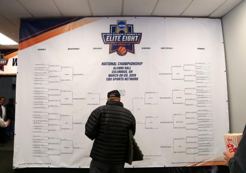 A basketball fan checks the NCAA DII Women's Basketball Bracket for updates.