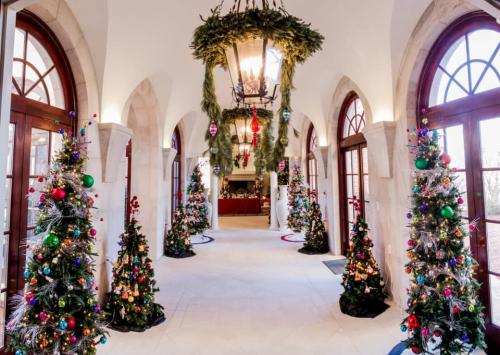 christmas trees adorn hallway