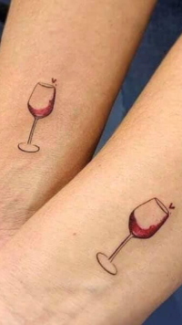 Earl Stillwagon and Michele Leighty got matching wine glass tattos