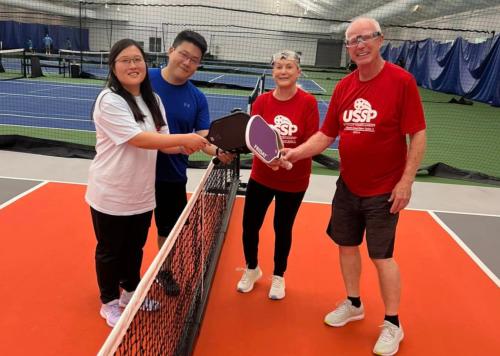 Pickleball players at The Courts indoor